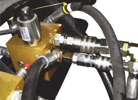 18. Connect auger/reel pressure and reel/auger return hoses from header to