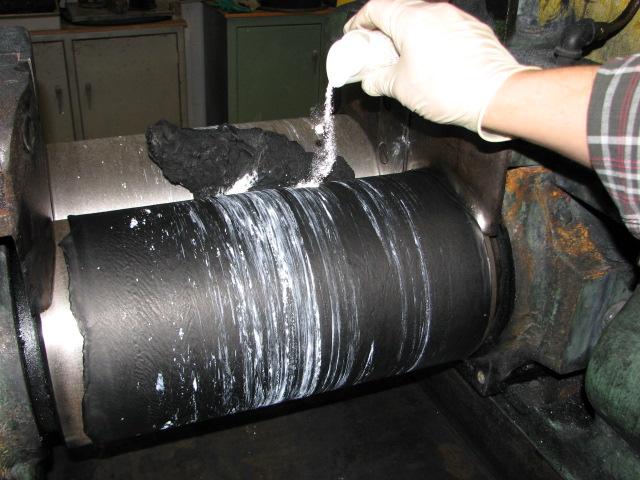Figure 4. Nitrile rubber compound being produced on rolling mill.