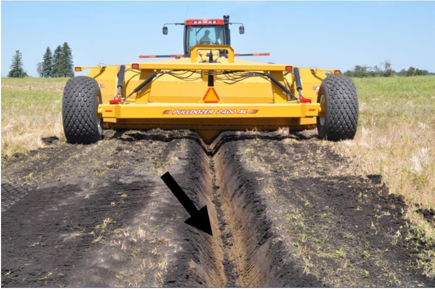2 OPERATION PULLDOZER TRANSFORMER Figure 3: Trench after the operation with no wind row ridges of dirt left Depth Penetration: The trencher comes with a depth indicator showing