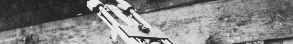 Above: An experimental twin anti-aircraft setup that clamps two BARs together. Note the curved plate in the center connected to the left-hand gun to deflect cases down and away from the other rifle.