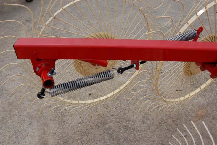 ADJUSTING INDIVIDUAL WHEEL ARM SPRING ON RCI RAKE Before adjusting spring tension adjust the wings as described on page 9 and hitch rake to the tractor it will run behind with the tongue as close to