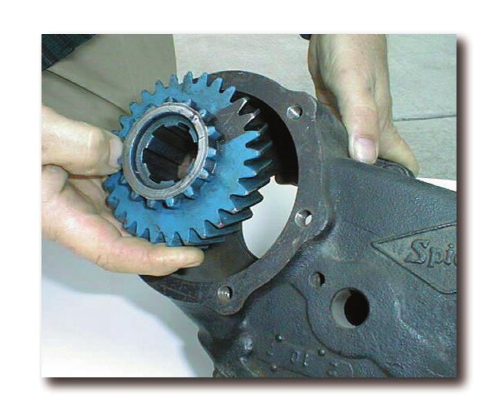 Using a socket wrench, remove the retaining nut that holds the stock drive gear in place. Remove the main drive gear (Fig 1) and make sure the new planetary gear assembly (Fig. (Fig. 1) 2) has the same number of exterior & interior teeth.