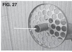24) to hold the clots that may partially or totally block the feed doors.
