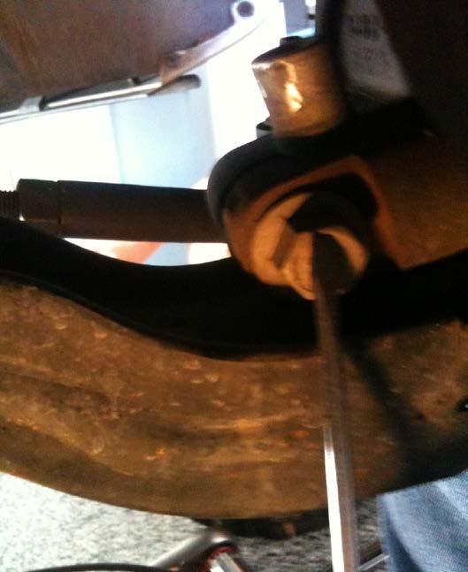 5. Carefully separate the steering knuckle from the ball joint and
