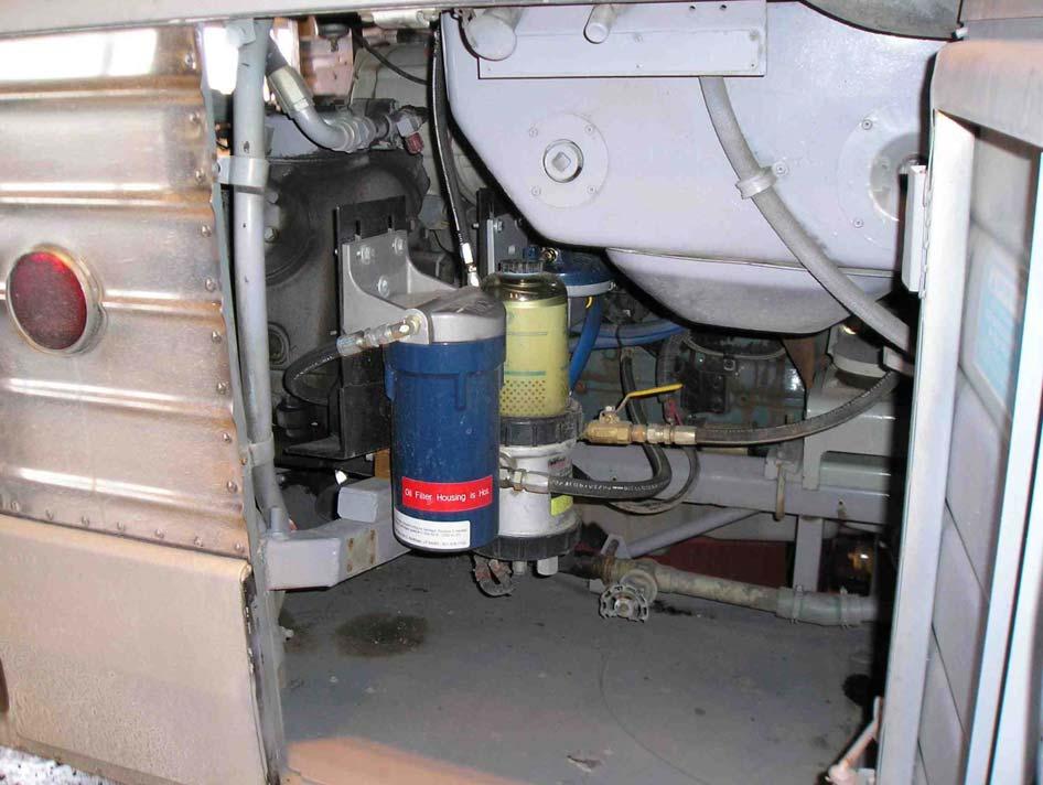 Figure 13 shows a view of the installed system in the passenger-side engine compartment.