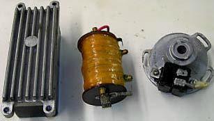 Type I Ignition System (1994-1997) Ignition Module: Plastic Box with Aluminum Cooling Fins on Top Ignition Module Mounted under Seat Installed in Urals from 1994 to 1997 Pot-Metal Rotor on Camshaft