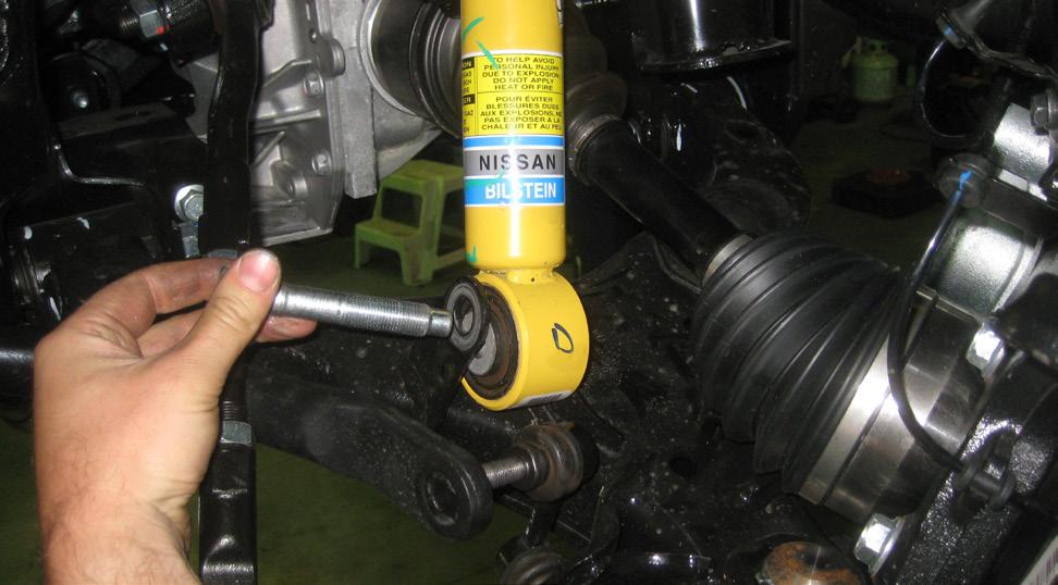 8. Move the the lower strut mounting bolt and remove