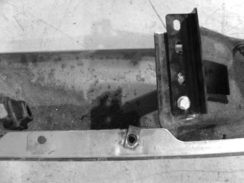 Figure 21 51. Install the bumper back on the vehicle by letting it rest on the new step spacer. Loosely fasten the center bracket with the factory hardware. 52.