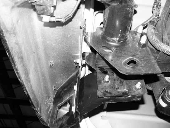 Figure 10 33. Remove the remaining two main bumper mounting bolts on on each side connecting the bumper bracket to bumper. Remove the bumper from the vehicle.