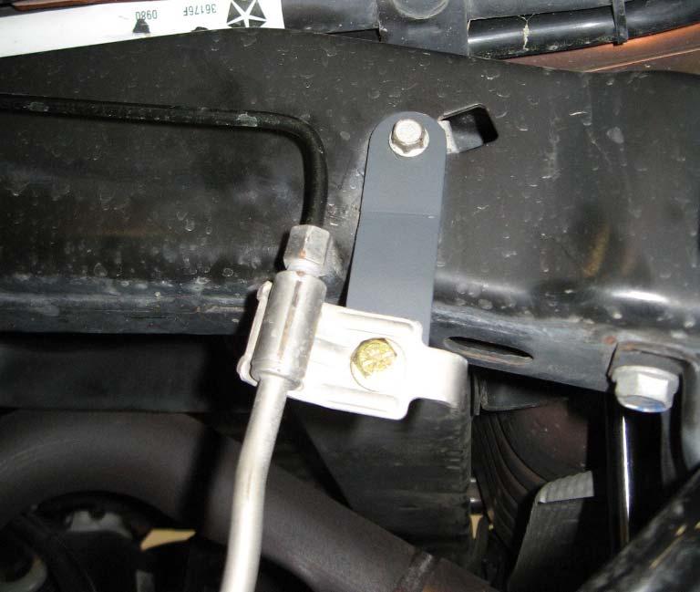 Install the rear brake line drop (35-TM20010) to the OE hole in the frame using the previously removed OE hardware. OE bolt 35-TM20010 Rear Brake Engine Compartment 1. Connect both battery cables.