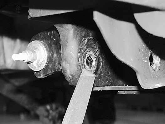Use a file or rotary grinder to remove the sharp lip left from the control arms (Fig 21).