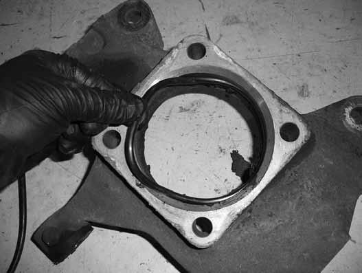 Swing the knuckle up and attach to the upper ball joint with the original nut.