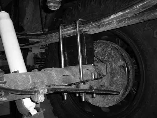 Figure 46 9. Repeat the installation on the driver's side of the vehicle. Pay special attention to all of the brake lines and wires. Do not allow them to get over-extended. SPRING INSTALLATION 10.