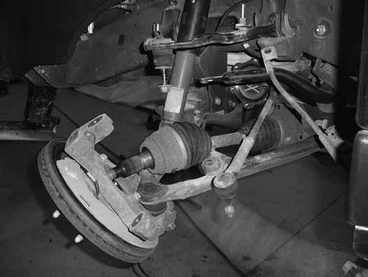Save the lower ball joint nut and set the knuckle/hub assembly aside. 23. Disconnect the shocks from the frame and lower control arm, keep the lower shock hardware.