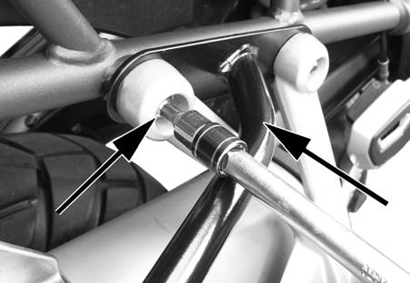 Do the same for each of the four bolts and spacers. Do not tighten the bolts fully yet.