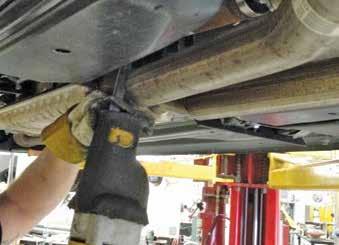mark the exhaust pipes as shown. 4. Push the rear exhaust pipes out of the way as needed and remove the resonator.