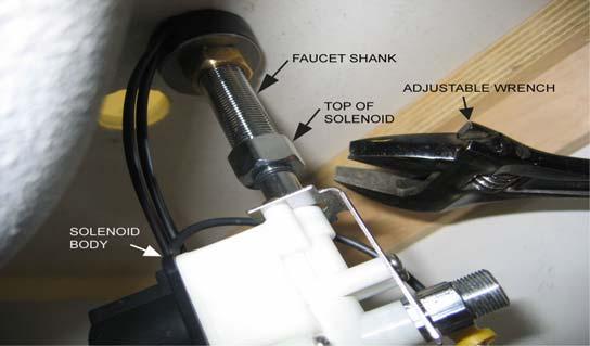 4of 18 Under sink, place rubber wire guard (with notch facing forward) and pass the wires through notch.
