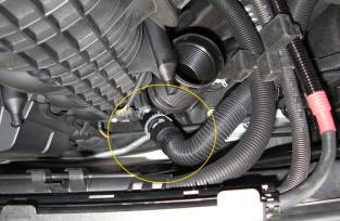 You can carefully move this out of the way, placing it on the weather-stripping at the back of the engine bay. This will give you enough room to remove the air box in the next step. 7.