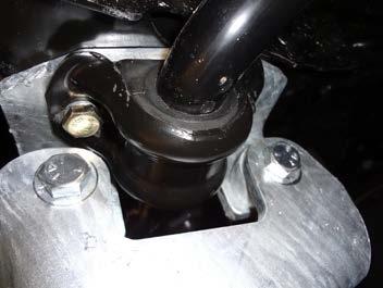 Lower the stabilizer bar by removing two bolts located on the bottom of the vehicle frame. Sandwich bracket (10) between the vehicle frame and a stabilizer bracket.