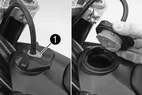 8Closing filler cap Replace the filler cap and turn clockwise until the release button locks in place. Route the fuel tank breather hose without kinking. 400199-11 3.