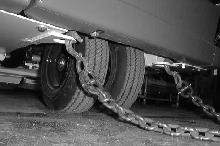 MAINTENANCE 3. To winch the machine onto the truck or trailer, attach the winching chains to the rear tie down locations.