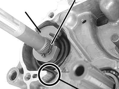 Turn around the crankcase so the right side crankcase faces upwards. And install the kick starter spring and kick spring retainer to the starter spindle.