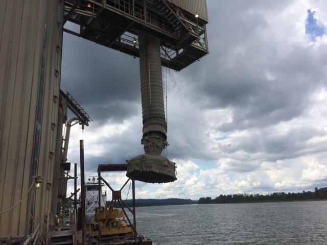 The victim was attempting to replace the lift cable pulleys on the barge loadout chute, when the anchor point for