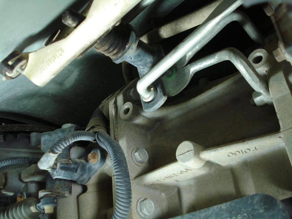 The upper bolt can be accessed through the shifter hole in the floor board if needed. (Fig13A & 13B) P.O.