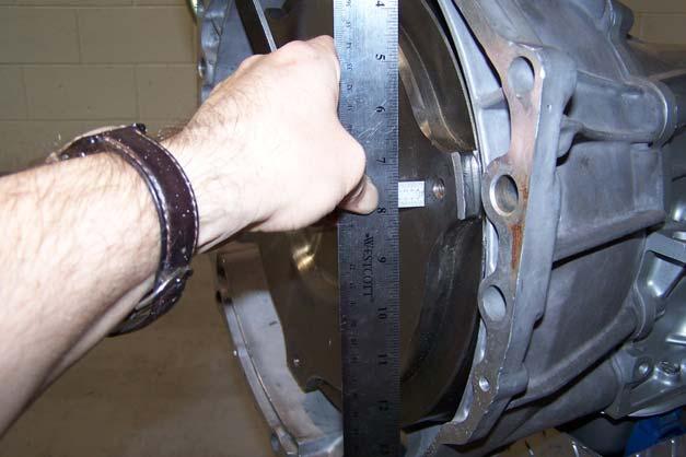 IF THE TORQUE CONVERTER IS REMOVED FROM THE INPUT SHAFT, BEFORE INSTALLATION FIRST MAKE SURE THE GARTER SPRING IS STILL IN PLACE INSIDE THE PUMP-TO-TORQUE CONVERTER SEAL.