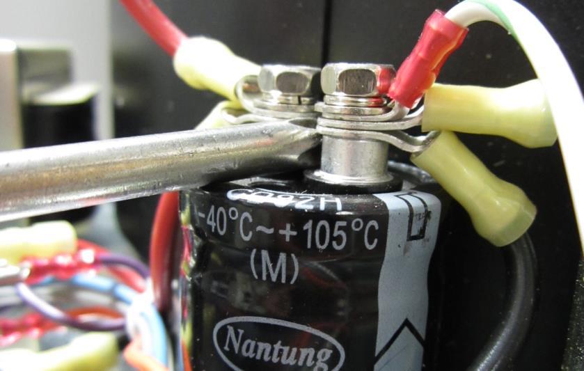 f) Once the voltage is below 0.5 V DC short the capacitor with a screwdriver. See fig 5 Fig 5 g) Connect the power leads to the PCB.