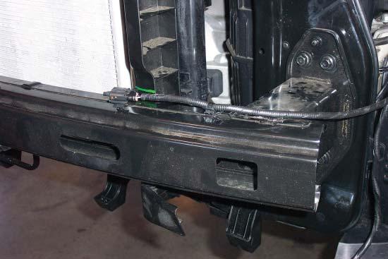Remove two clips attaching the ambient temperature sensor to the bumper core (Fig.F). 6.
