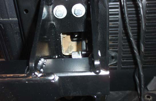Place one of the supplied 3/8" x 1½" x 1½" spacers between the inside of the side plate and the rear support brace, and bolt through