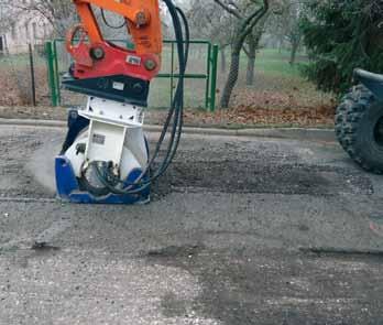 An EX 45 exactor milling a road surface.