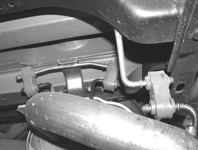 4. Using a muffler stand or an additional person to hold the exhaust system in place, remove the hangers shown in figure 3 from the rubber brackets. 5.
