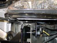 6. Remove the headlights (four 10mm head) bolts