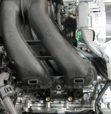 Using a 10mm socket, unbolt the throttle body from the intake manifold.