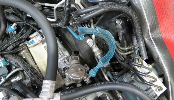Install the low pressure fuel feed line onto the banjo fuel fitting.