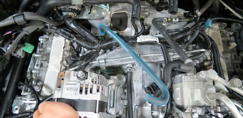 Remove the throttle body coolant hose from the coolant