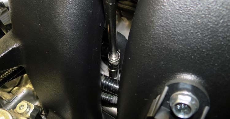 universal socket. 102. Position the supercharger forward to access the rear intercooler fittings.