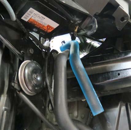 Install the Intercooler to Surge Tank hose onto the passenger side