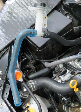 Position the ¾ hose clamp ears away from the brake lines.