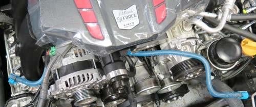 109. With the intercooler hoses properly secured, reposition the