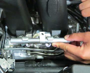 114. With the fuel injectors securely positioned and properly clocked on the