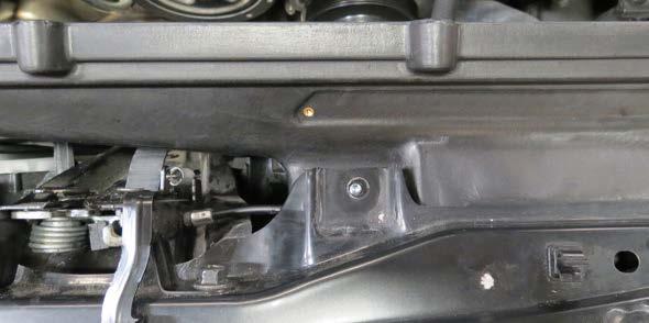 the front air box shroud to the upper radiator support.