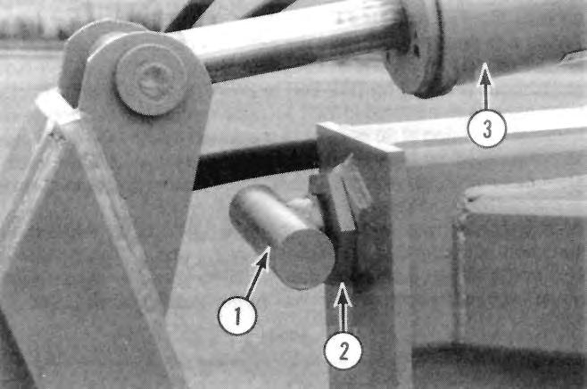 The hitch cylinder moved the hitch vertically until the frame rested against the t-bar. To prevent t-bar damage it should be secured in a horizontal position by the locking nut.