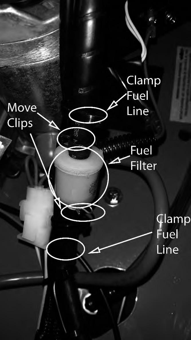 The fuel filter is located in the fuel line, on the left side of the engine, by the starter motor. Replace the filter yearly.