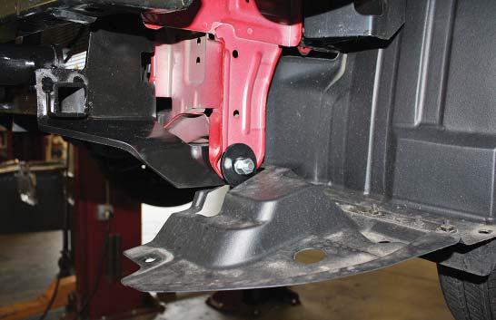 On each side, place a ½" flat washer over a ½" x 2" bolt and bolt through the main receiver brace and the tow loop mounts.