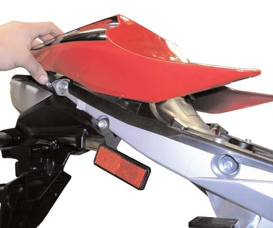 stand. 2) Remove the two bolts securing the rider seat to the motorcycle. Remove the seat. See Figure #1 3) Using the key, remove the passenger seat.