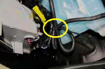 13. From behind fender liner, disconnect and remove the driver s side factory fog