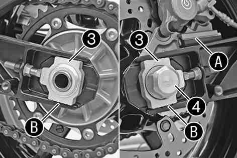 Install the rubber damper and rear sprocket carrier in the rear wheel. Stand the rear wheel in the swingarm and mount the brake caliper on the brake disc.